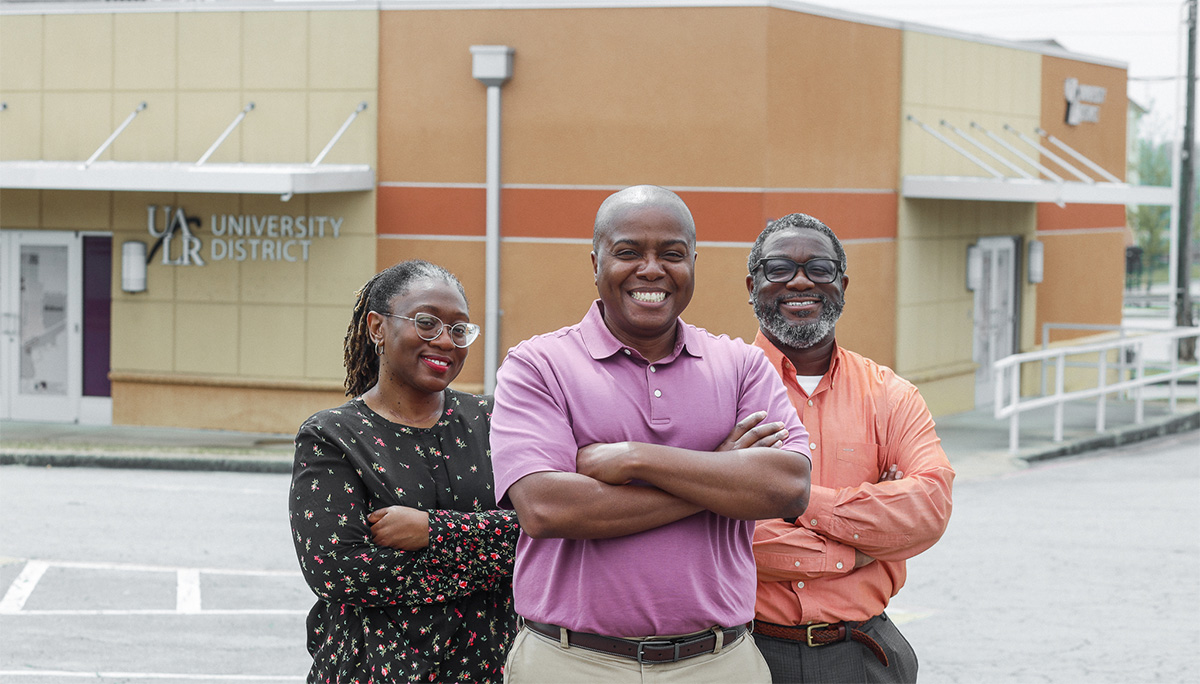 3 HOPE members and new small business owners, standing in front of their business building.