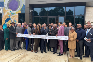 Ribbon cutting at the new HOPE Economic Mobility Center with HOPE employees and community partners.